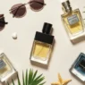 A curated summer-themed flat lay of premium men's colognes, representing the best summer perfumes for men to wear in 2025, with tropical props and a fresh, masculine aesthetic.