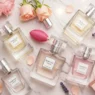 Affordable and elegant women’s perfume bottles arranged with floral decor – top picks under $50 on Dr Top List.