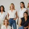 Women modeling 2025 blouse trends including loose V-neck and cap sleeve styles, perfect for both casual and formal occasions.